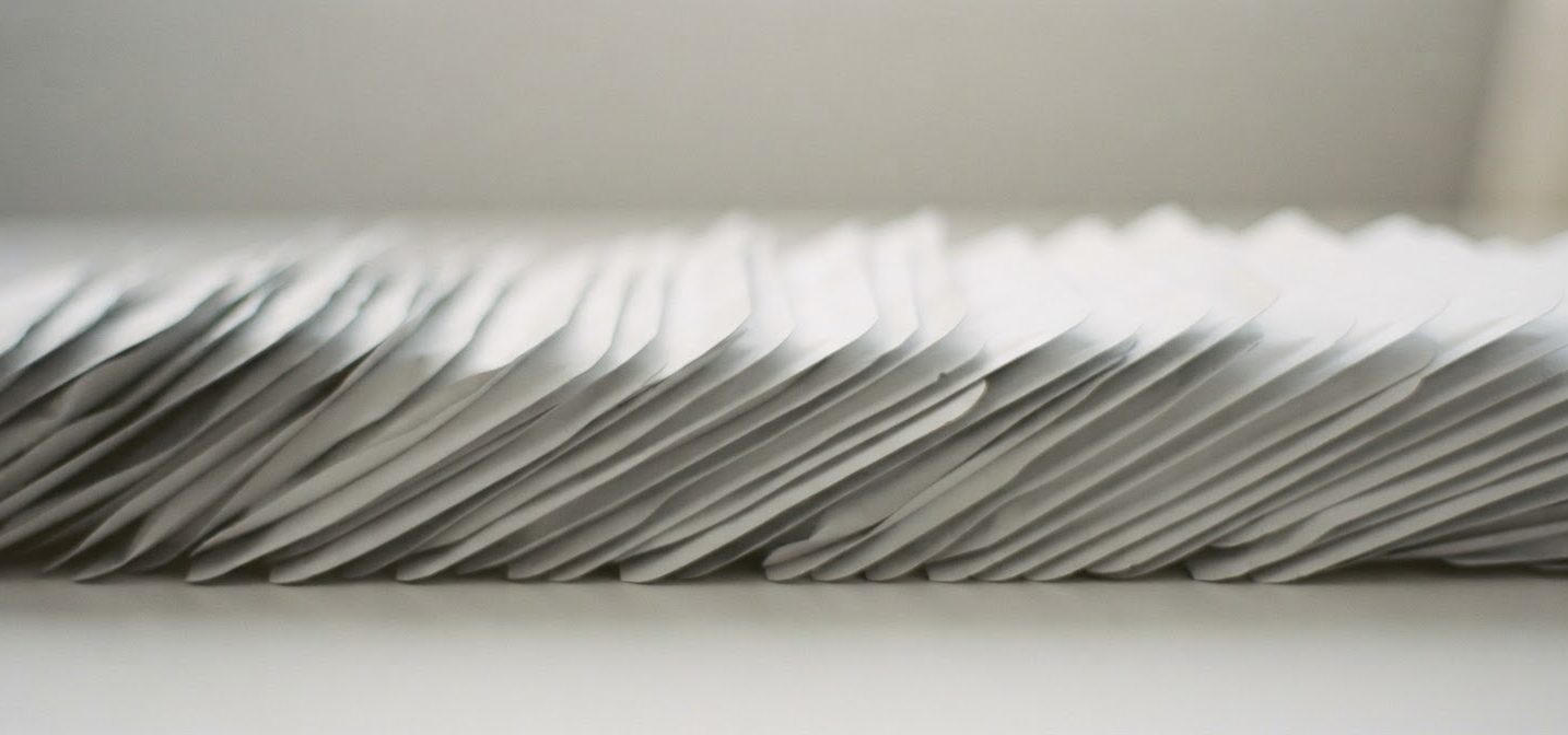 Stacked white sheet mask pouches